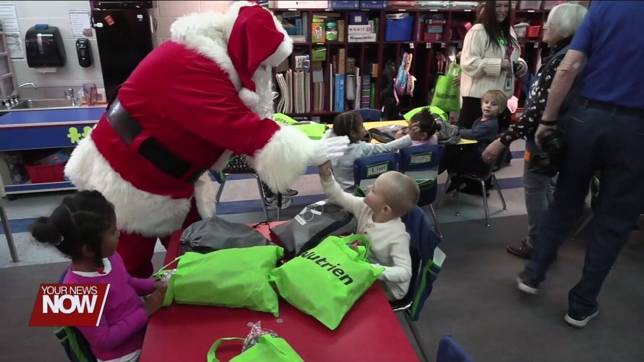 Lima Exchange Club brings Christmas gifts to Freedom Elementary students
